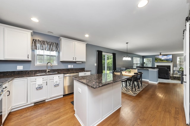 741 Oakwood St, Minooka, IL 60447 - kitchen featuring dishwasher, white cabinetry, light wood-style flooring, a center island, and recessed lighting
