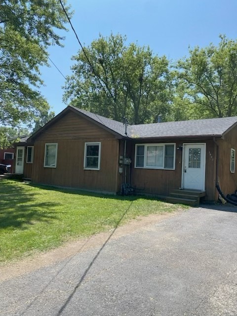3007 30th St, Zion, IL 60099 - rear view of house featuring a lawn