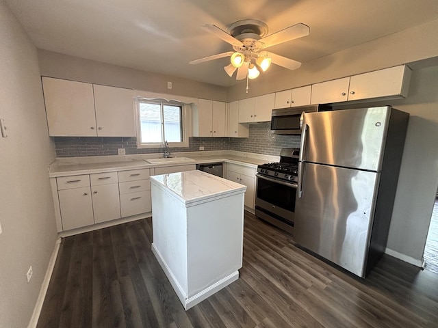 126 N Prairie Ave, Bloomingdale, IL 60108 - kitchen featuring stainless steel appliances, dark wood-type flooring, light countertops, and tasteful backsplash