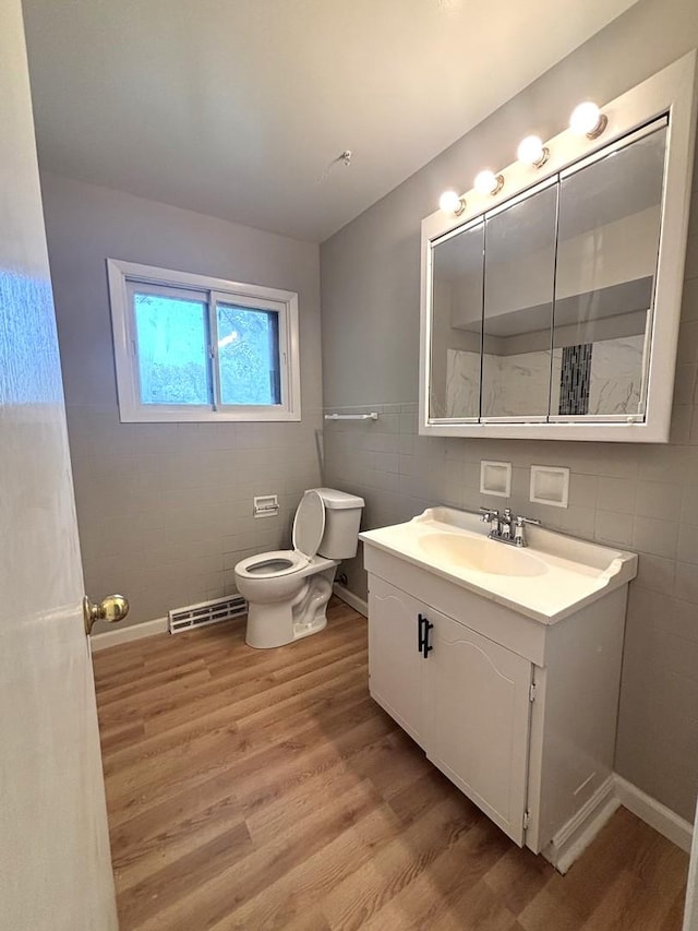 126 N Prairie Ave, Bloomingdale, IL 60108 - bathroom featuring tile walls, wood finished floors, and vanity