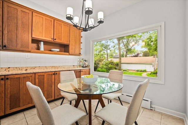 633 Forest Ave, Wilmette, IL 60091 - dining area with light tile patterned floors, a chandelier, and a baseboard heating unit
