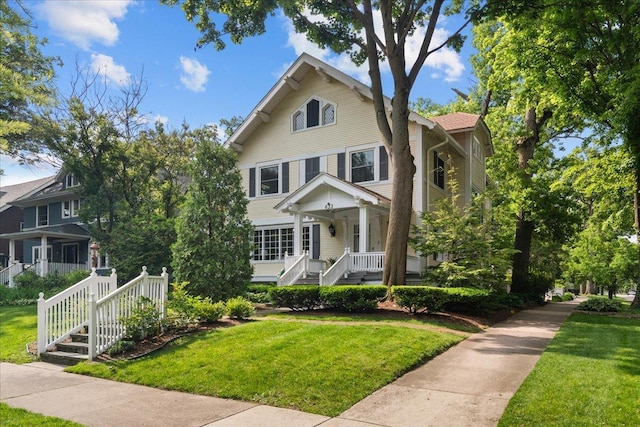 633 Forest Ave, Wilmette, IL 60091 - view of front of home featuring a porch, a front yard, and stairs