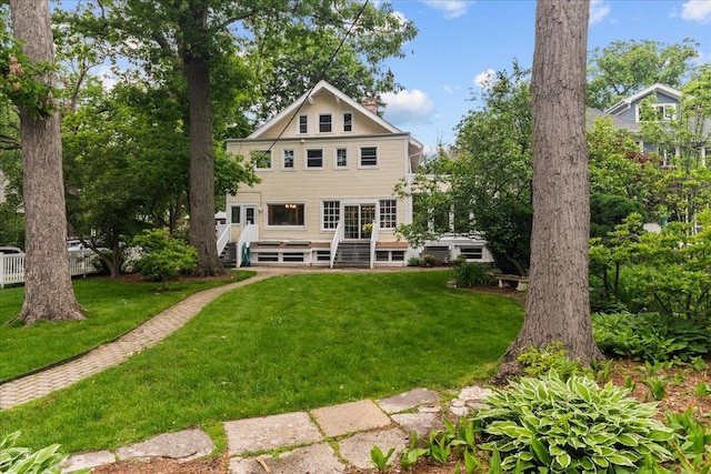 633 Forest Ave, Wilmette, IL 60091 - back of house with a lawn and a deck