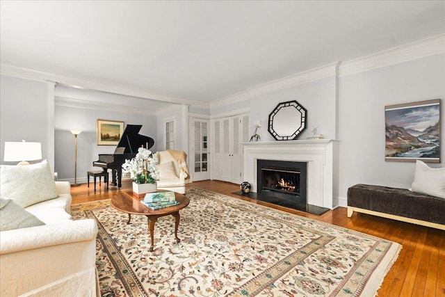 633 Forest Ave, Wilmette, IL 60091 - living room with crown molding, a lit fireplace, and hardwood / wood-style floors