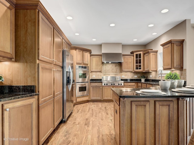 508 Gene Darfler Ct, Naperville, IL 60565 - kitchen featuring appliances with stainless steel finishes, light wood-style floors, a peninsula, glass insert cabinets, and brown cabinetry