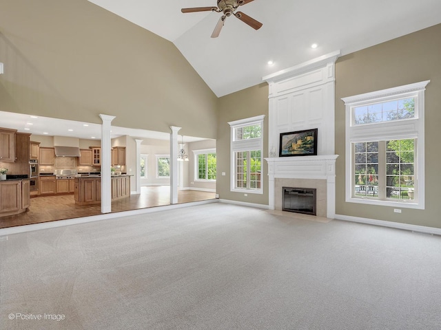 508 Gene Darfler Ct, Naperville, IL 60565 - unfurnished living room with high vaulted ceiling, a large fireplace, ceiling fan, light colored carpet, and recessed lighting