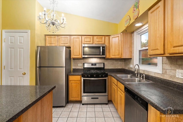 1018 Bob O Link Ln, Darien, IL 60561 - kitchen featuring stainless steel appliances, lofted ceiling, tasteful backsplash, light tile patterned floors, and dark countertops