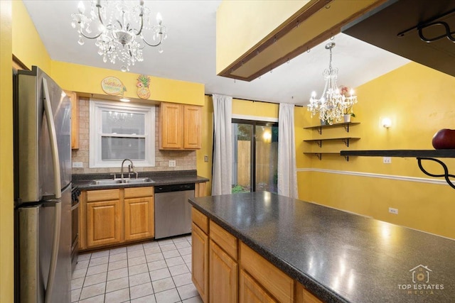1018 Bob O Link Ln, Darien, IL 60561 - kitchen featuring stainless steel appliances, a chandelier, backsplash, dark countertops, and light tile patterned floors