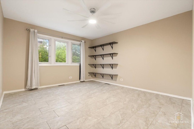 1018 Bob O Link Ln, Darien, IL 60561 - spare room with ceiling fan and baseboards