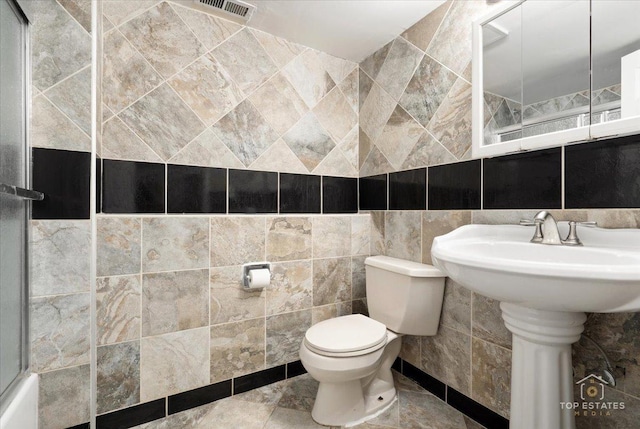 1018 Bob O Link Ln, Darien, IL 60561 - bathroom with tile walls and a shower with shower door