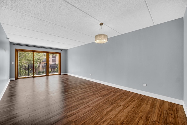1636 Ashland Ave Unit 209, Des Plaines, IL 60016 - unfurnished room with dark wood finished floors and a textured ceiling