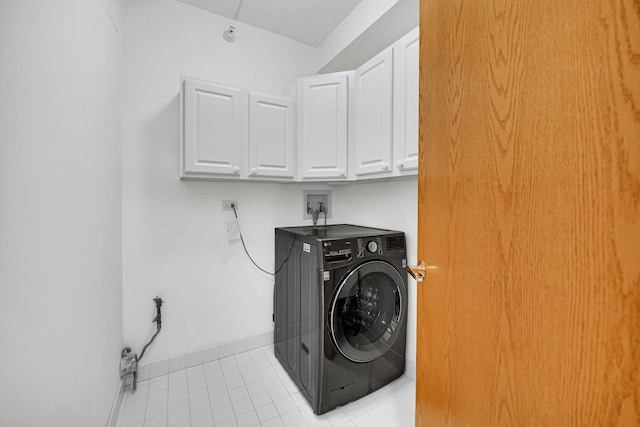1636 Ashland Ave Unit 209, Des Plaines, IL 60016 - laundry room with washer / clothes dryer, cabinet space, and light tile patterned floors