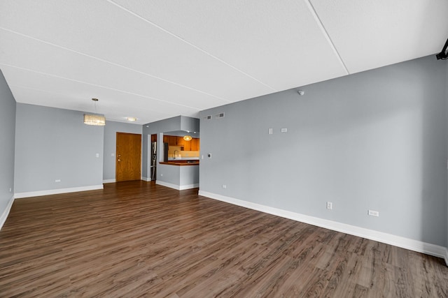 1636 Ashland Ave Unit 209, Des Plaines, IL 60016 - unfurnished living room featuring wood finished floors and baseboards
