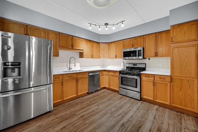 1636 Ashland Ave Unit 209, Des Plaines, IL 60016 - kitchen with stainless steel appliances, light countertops, wood finished floors, and brown cabinetry