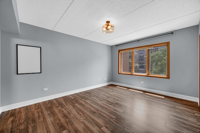 1636 Ashland Ave Unit 209, Des Plaines, IL 60016 - empty room featuring a textured ceiling and wood finished floors