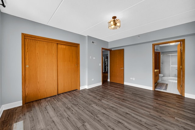 1636 Ashland Ave Unit 209, Des Plaines, IL 60016 - unfurnished bedroom featuring wood finished floors, a closet, and connected bathroom