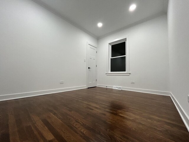 4843 W Schubert Ave, Chicago, IL 60639 - spare room featuring dark wood-style floors, ornamental molding, and recessed lighting