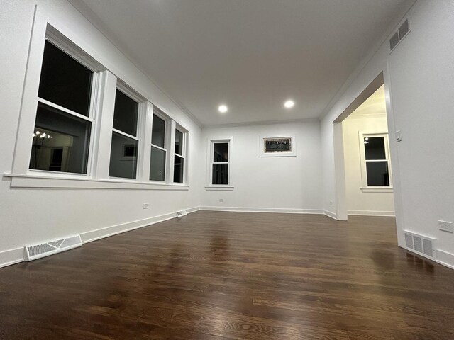 4843 W Schubert Ave, Chicago, IL 60639 - unfurnished room with wood finished floors, recessed lighting, built in features, and crown molding