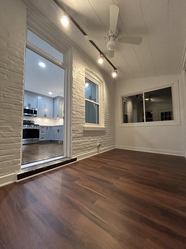 4843 W Schubert Ave, Chicago, IL 60639 - empty room featuring dark wood-style flooring and ceiling fan