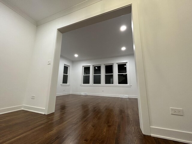 4843 W Schubert Ave, Chicago, IL 60639 - empty room with crown molding, dark wood-type flooring, and recessed lighting
