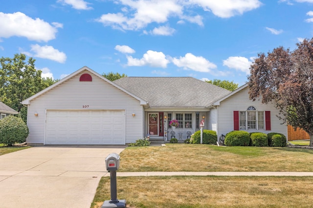 107 Sibley Dr, Minooka, IL 60447 - traditional home with concrete driveway, a garage, a front yard, and a shingled roof