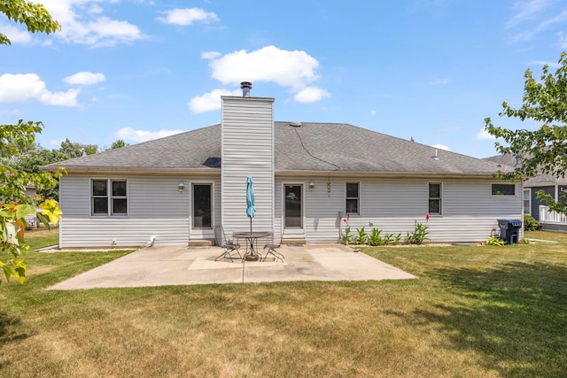 107 Sibley Dr, Minooka, IL 60447 - rear view of house with a yard, a patio, and a chimney