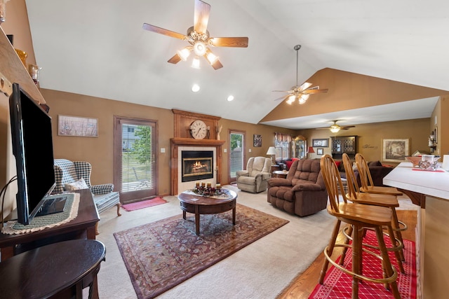 107 Sibley Dr, Minooka, IL 60447 - living area with ceiling fan, a tiled fireplace, recessed lighting, and high vaulted ceiling