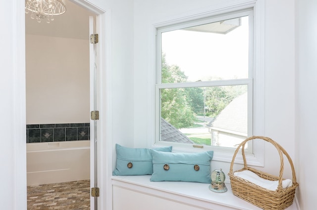 902 Heathrow Ln, Naperville, IL 60540 - bathroom featuring a bath and a chandelier