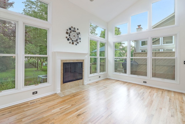902 Heathrow Ln, Naperville, IL 60540 - unfurnished living room with wood finished floors, high vaulted ceiling, and a fireplace