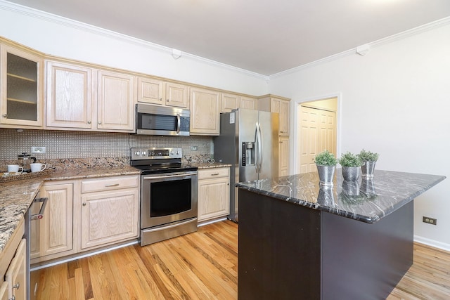 902 Heathrow Ln, Naperville, IL 60540 - kitchen with stainless steel appliances, crown molding, light wood-type flooring, dark stone countertops, and backsplash