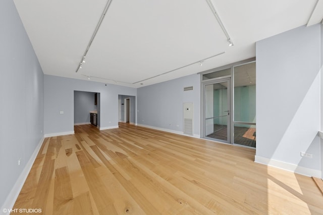 8 E Randolph St Unit 3203, Chicago, IL 60601 - empty room featuring track lighting and light wood-style flooring