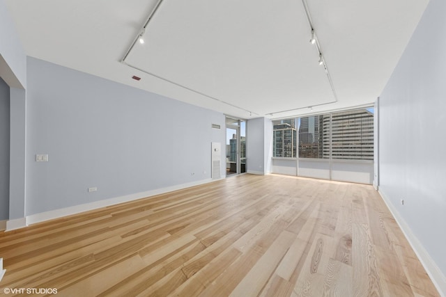 8 E Randolph St Unit 3203, Chicago, IL 60601 - spare room with track lighting, light wood-style floors, and attic access