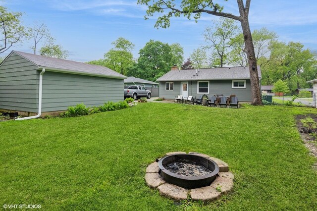 2365 N Barrington Woods Rd, Palatine, IL 60074 - back of property featuring an outdoor fire pit and a chimney