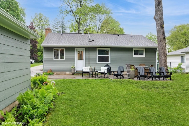 2365 N Barrington Woods Rd, Palatine, IL 60074 - back of house with a chimney, a patio, and roof with shingles
