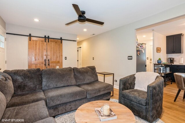 2365 N Barrington Woods Rd, Palatine, IL 60074 - living room featuring light wood finished floors, ceiling fan, a barn door, and recessed lighting