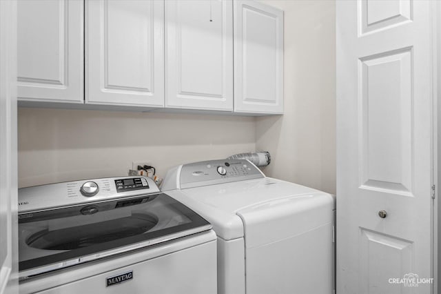 1568 Sedona Ave, Aurora, IL 60504 - laundry room featuring cabinet space and washer and dryer