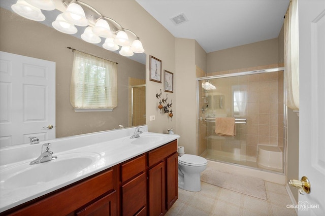 1568 Sedona Ave, Aurora, IL 60504 - full bath featuring a shower stall, double vanity, and tile patterned floors