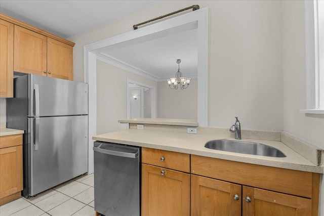 819 Forest Ave Unit 2W, Evanston, IL 60202 - kitchen featuring appliances with stainless steel finishes, light countertops, ornamental molding, light tile patterned floors, and a chandelier