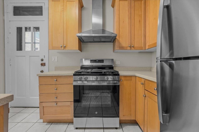 819 Forest Ave Unit 2W, Evanston, IL 60202 - kitchen featuring stainless steel appliances, wall chimney exhaust hood, light tile patterned floors, and light countertops