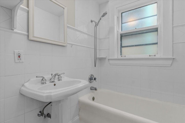 819 Forest Ave Unit 2W, Evanston, IL 60202 - bathroom with tile walls, tub / shower combination, and decorative backsplash