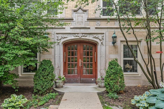 819 Forest Ave Unit 2W, Evanston, IL 60202 - view of exterior entry with french doors, brick siding, and stone siding