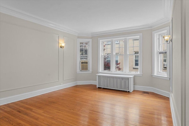 819 Forest Ave Unit 2W, Evanston, IL 60202 - unfurnished room with radiator, light wood finished floors, ornamental molding, and cooling unit