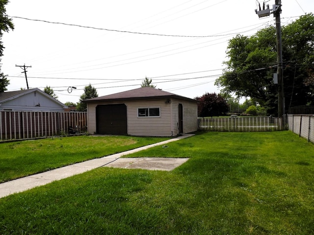 17008 Oakwood Ave, Lansing, IL 60438 - fenced backyard with a detached garage and an outdoor structure
