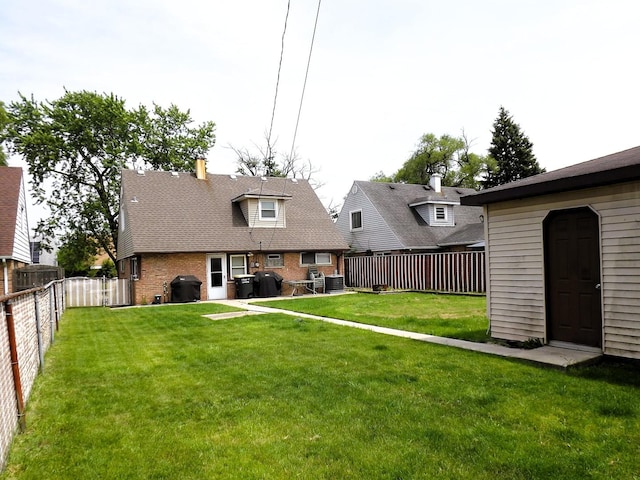 17008 Oakwood Ave, Lansing, IL 60438 - rear view of property featuring brick siding and a fenced backyard