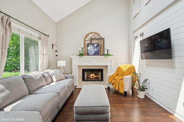 2570 Fairfax Ln, Lake In The Hills, IL 60156 - living room featuring a tile fireplace, dark wood-type flooring, and high vaulted ceiling