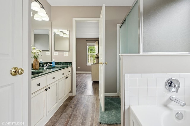 2570 Fairfax Ln, Lake In The Hills, IL 60156 - full bathroom with vanity, wood finished floors, and a bath