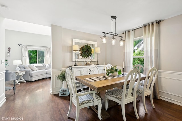 2570 Fairfax Ln, Lake In The Hills, IL 60156 - dining space featuring wainscoting, dark wood-style flooring, and a decorative wall