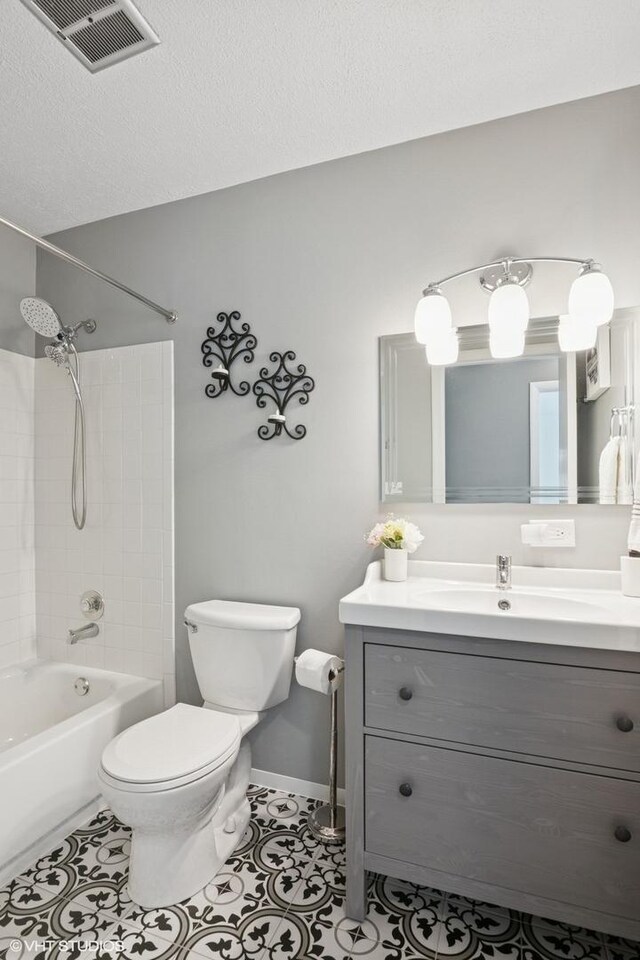 1351 Kingsbury Dr Unit 5, Hanover Park, IL 60133 - bathroom featuring vanity,  shower combination, and tile patterned flooring