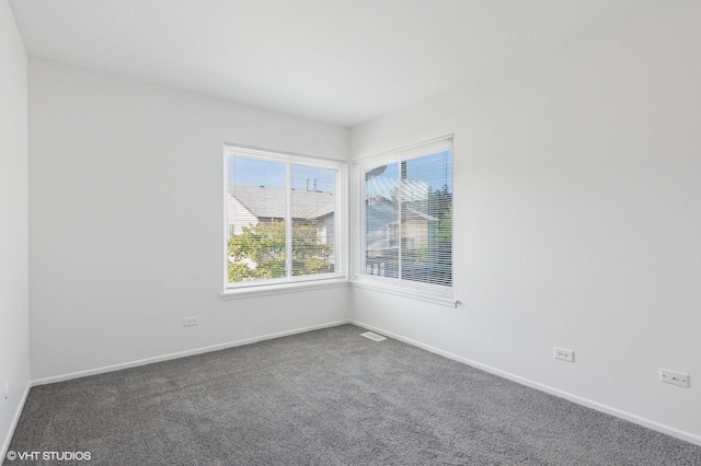 1351 Kingsbury Dr Unit 5, Hanover Park, IL 60133 - carpeted spare room featuring baseboards
