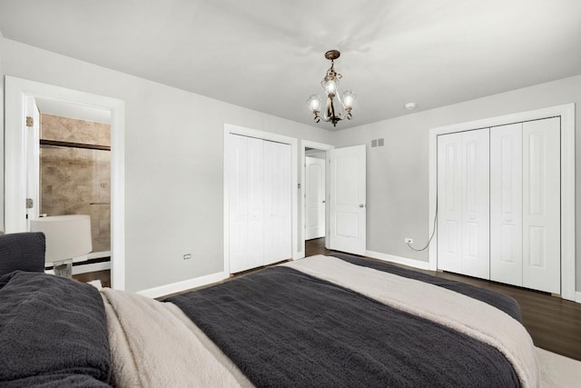 12620 S Kinvarra Dr, Palos Park, IL 60464 - bedroom featuring a chandelier, dark wood-style flooring, multiple closets, and connected bathroom